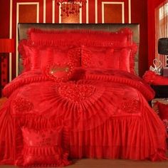 red bedding with hearts and ruffles on it