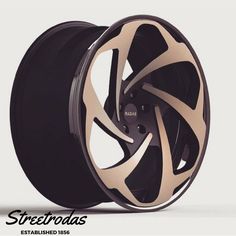 an image of a wheel that is black and gold