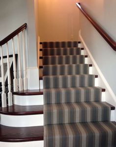 the stairs in this house are painted gray and white