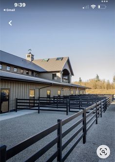 an empty barn with several stalls on the side