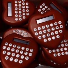 a bunch of red typewriters sitting on top of each other