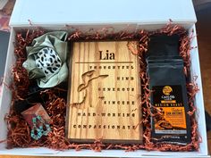 an open box containing various items including coffee, tea bags and other things in it