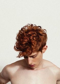 a shirtless man with red hair and no shirt