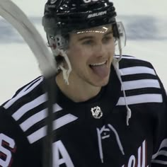 a hockey player making a face with his mouth open