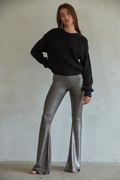 These babies are smooothhhh! Featuring a dark espresso base with deep chocolate-y metallic stripes, pull-on high waist, and stretchy body. These bell bottoms are SO flattering and make you have legs 👏🏻 for 👏🏻 days 👏🏻. Shelly is wearing size small. Black Stretch Shiny Bottoms, Black Shiny Stretch Bottoms, Stretch Shiny Black Bottoms, Fall Shiny Stretch Bottoms, Shiny Stretch Bottoms For Fall, Sleek Stretch Shiny Pants, Shiny Fitted Pants For Fall, Fitted Shiny Pants For Fall, Fall Shiny Stretch Leggings