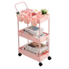 a pink cart filled with lots of books and other things on top of each shelf