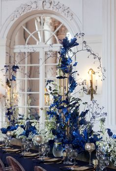 a long table with blue and white flowers on it