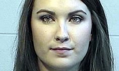 a woman with long black hair and brown eyes is shown in this mugshot photo