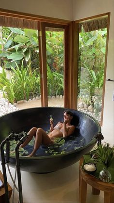 a woman is relaxing in the jacuzzi tub