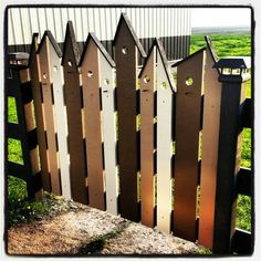 a wooden fence that has been made to look like it is in the middle of nowhere