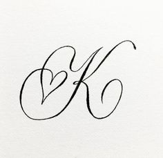 the letter k in cursive writing is black ink on white paper with a pen