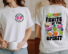 "Fruits Of The Spirit Shirt, Galatians 5:22 Tshirt, Bible Verse T Shirt, Christian Tee, Religious Shirt, Vacay Mode, Inspirational Tshirt HOW TO ORDER: Please follow these 5 simple steps: 1. Select the style and size you want in the \"Style (Size)\" option. 2. Select the shirt color you want in the \"Color\" option. 3. [APPLICABLE ONLY ON CERTAIN LISTINGS] Follow the instructions to fill out the \"Add your personalization\" option, e.g. specifying custom sayings or selecting design colors 4. Sel Fruit Of The Spirit Shirt, Bible Verse T Shirt, Church Merch, Galatians 5 22, Fruits Of The Spirit, Christian Merch, Vacay Mode, Inspirational Tshirts, Spirit Shirts