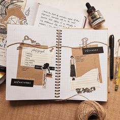 an open notebook with pictures on it next to some crafting supplies and other items