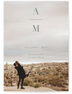 a woman standing on top of a rock in the desert