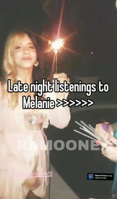 a woman holding a sparkler in her hand next to another person with the caption late night listenings to melanie > > > > > > > > >