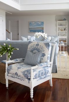 a blue and white chair in a living room