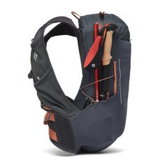 an image of a back pack with fishing equipment in it's pocket and attached to the back