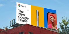 an advertisement for the new google phone is displayed on top of a red brick building