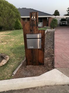 the mailbox is made out of wood and metal