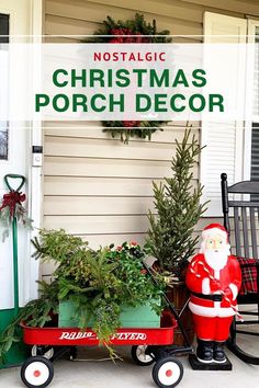 a christmas porch decoration with santa clause on the front door and evergreens in a wagon