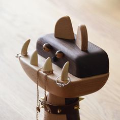 a wooden toy with several teeth attached to it