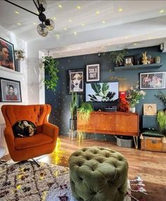 a living room filled with furniture and pictures on the wall