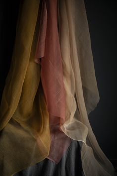 Ochre {Gossamer Silk Fabric} Hand-loomed, 100% organic silk fabric. This material has a unique body and texture. The light airiness of our gossamer silk creates a transparent veil of color when used for flatlay photography or vignette styling. Create a sculptural look when tucked and pinned. Creates a show-stopping look when draped on a table, or hanging as a backdrop. Planning a large event? Contact us for larger quantities here. Ochre Gossamer Silk Fabric has many uses! • Use as a transparent Silk Product Photography, Fabric Flatlay, Maria Zhgenti, Fabric Studies, Transparent Veil, Texture Studies, Fashion Design Studio, Mushroom Costume, Wearing A Scarf