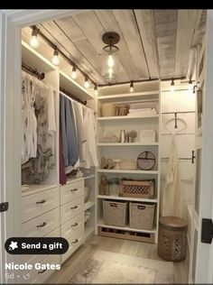 a walk in closet filled with lots of white drawers and baskets on top of it