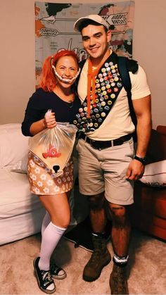 a man and woman dressed up in costume posing for the camera with one holding a bag