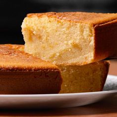 two pieces of cake sitting on top of a white plate