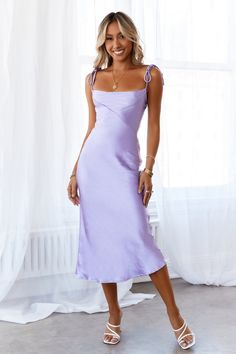 Length from shoulder to hem of size S: 104cm. Lavender midi dress. Not-lined. Cold hand wash only. Model is a standard XS and is wearing size XS. True to size. Lightweight, non-stretchy woven satin fabric. Cowl neck. Adjustable tie-up shoulder straps. No zipper. Slip-on style. Polyester. Feel the good vibes and energy in the Slip Into The Night Midi Dress. This stunning chic piece is simple but has all the features you are dreaming of. Showcasing a cowl-neck style, tie up shoulder straps and sat Lavender Midi Dress, Mesh Party Dress, Bodycon Dress Formal, Dress Lavender, Lavender Dresses, Long Sleeve Dress Formal, Into The Night, Midi Dress Party, Long Sleeve Lace Dress