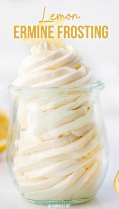 A bowl filled with lemon ermine frosting and topped with a fresh wedge of lemon. Cake With Ermine Frosting, Lemon Marshmallow Frosting, Light Lemon Frosting, Lemon Ermine Frosting, Flavored Ermine Frosting, Lemon Icing For Cake, Lemon Frosting Easy, Ermine Frosting Recipes, Ermine Icing