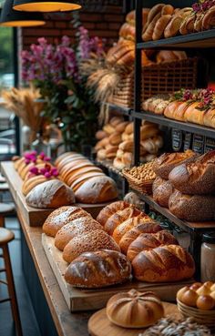 breads and pastries on display in a bakery