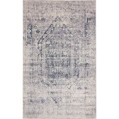 an antique rug with faded blue and white colors