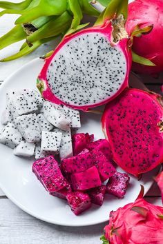 dragon fruit cut up on a white plate