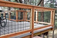 a wooden deck with metal bars and railings