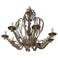 an ornate chandelier with five candles on it