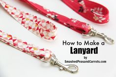 three lanyards with red and white designs on them, one has a metal hook