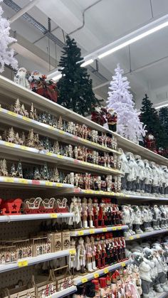 christmas decorations are on shelves in a store