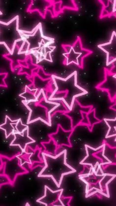 many pink and white stars on a black background