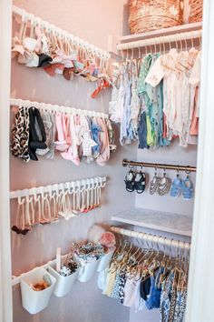 the closet is full of baby clothes and shoes