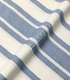 blue and white striped fabric that is very close to the ground, with lines on it