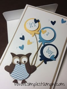 a card with an owl holding two balloons and the words it's a boy