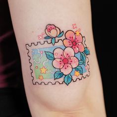 a stamp with flowers and stars on the side of it's leg is shown