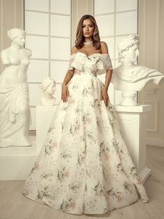 This romantic floral printed dress exudes elegance with its beautiful maxi length and delicate ivory color. Perfect for summer parties or as a stunning choice for a wedding guest, this long floral dress combines timeless charm with sophistication, making it an ideal addition to any wardrobe✨ 💕 Highlights:   - made of high-quality matte organza with floral print  - available in ivory color  - maxi-length lightweight skirt   - open shoulders    - the bust is emphasized with the help of a cutout ? Floral Print Prom Gown For Spring, Spring Floral Print Prom Gown, Spring Floral Print Gown For Garden Party, Spring Garden Party Ball Gown, Floral Print Ball Gown For Wedding, Floor-length Dresses For Garden Party Prom Season, Floor-length Dresses For Garden Party And Prom Season, Cream Maxi Dress For Prom, Summer Wedding Ball Gown