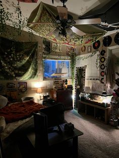 a bedroom with lots of decorations on the ceiling