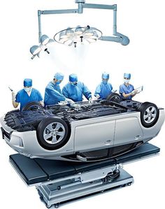 a group of doctors working on a car with the hood up and engine in place