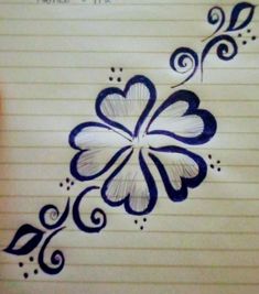 a drawing of a flower on lined paper