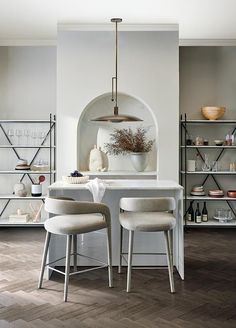 the kitchen is clean and ready to be used for cooking or dining, while also being used as a storage space