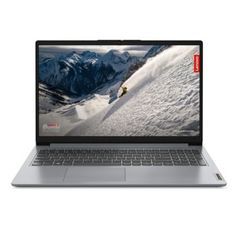 an open laptop computer sitting on top of a white surface with snow covered mountains in the background